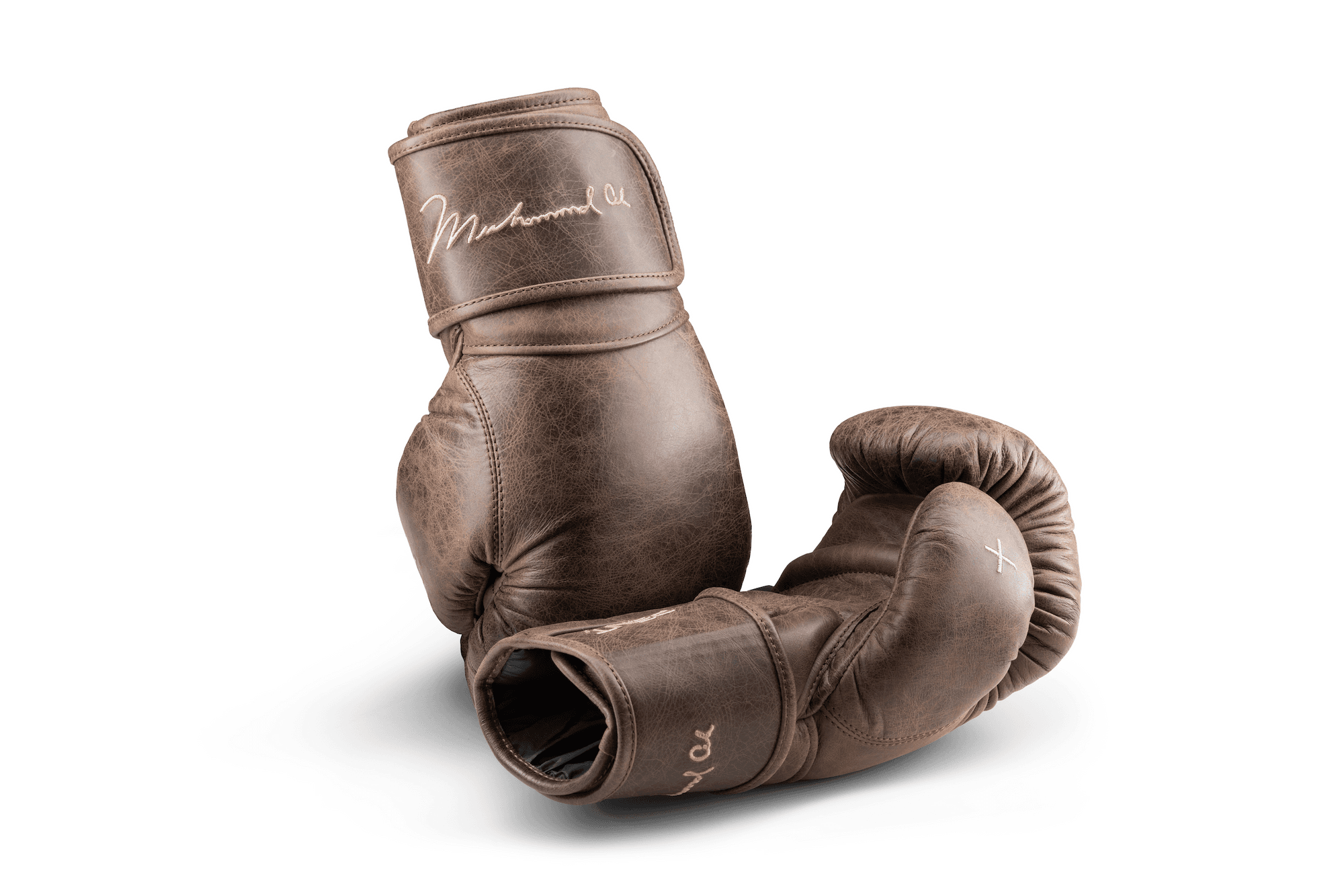 PENT × Muhammad Ali vintage brown leather boxing gloves with Muhammad Ali’s signature embroidered on the wrist strap