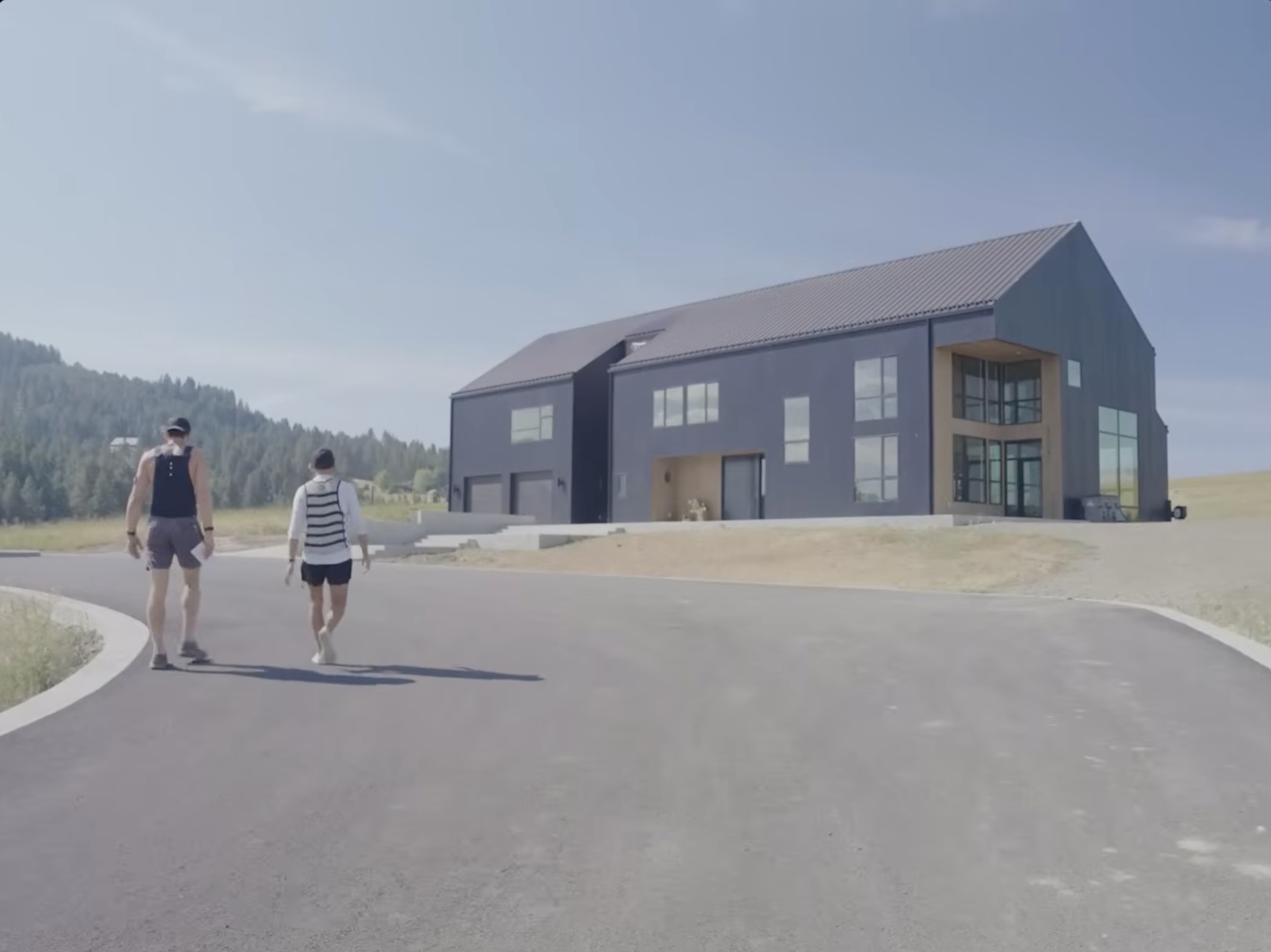 Long approach to the Greenfield compound, Idaho hills in the background