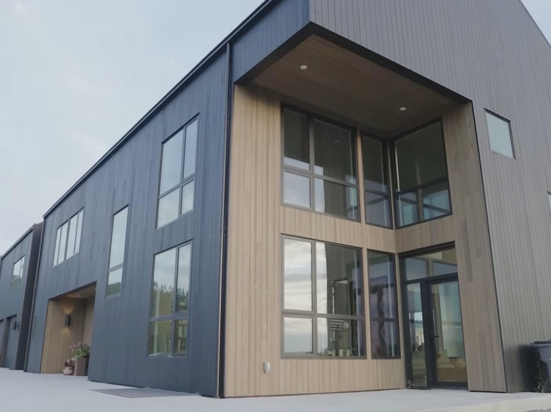 Entry elevation in charred wood siding with natural cedar accent panel