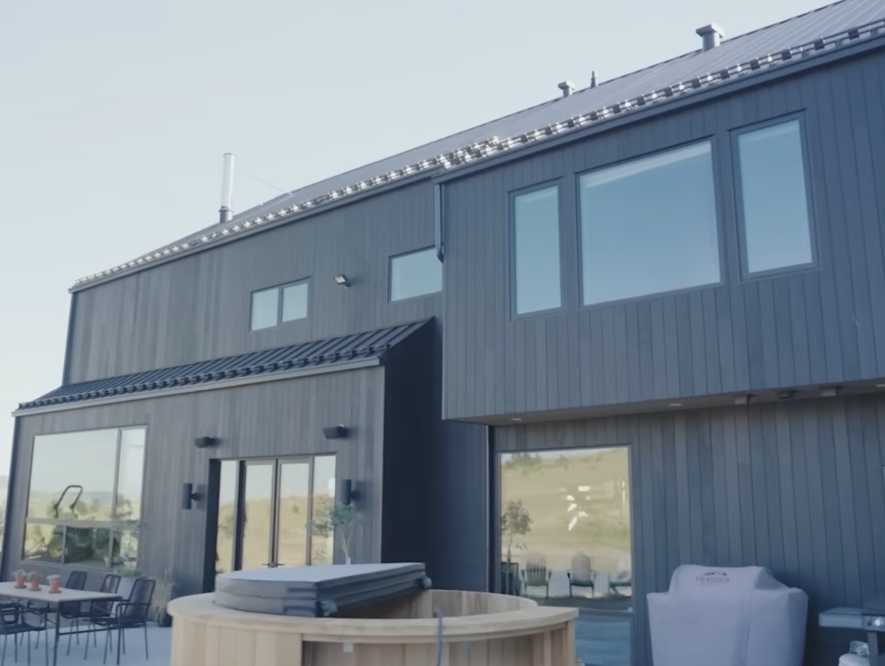 Rear elevation with cedar cold plunge and outdoor dining area