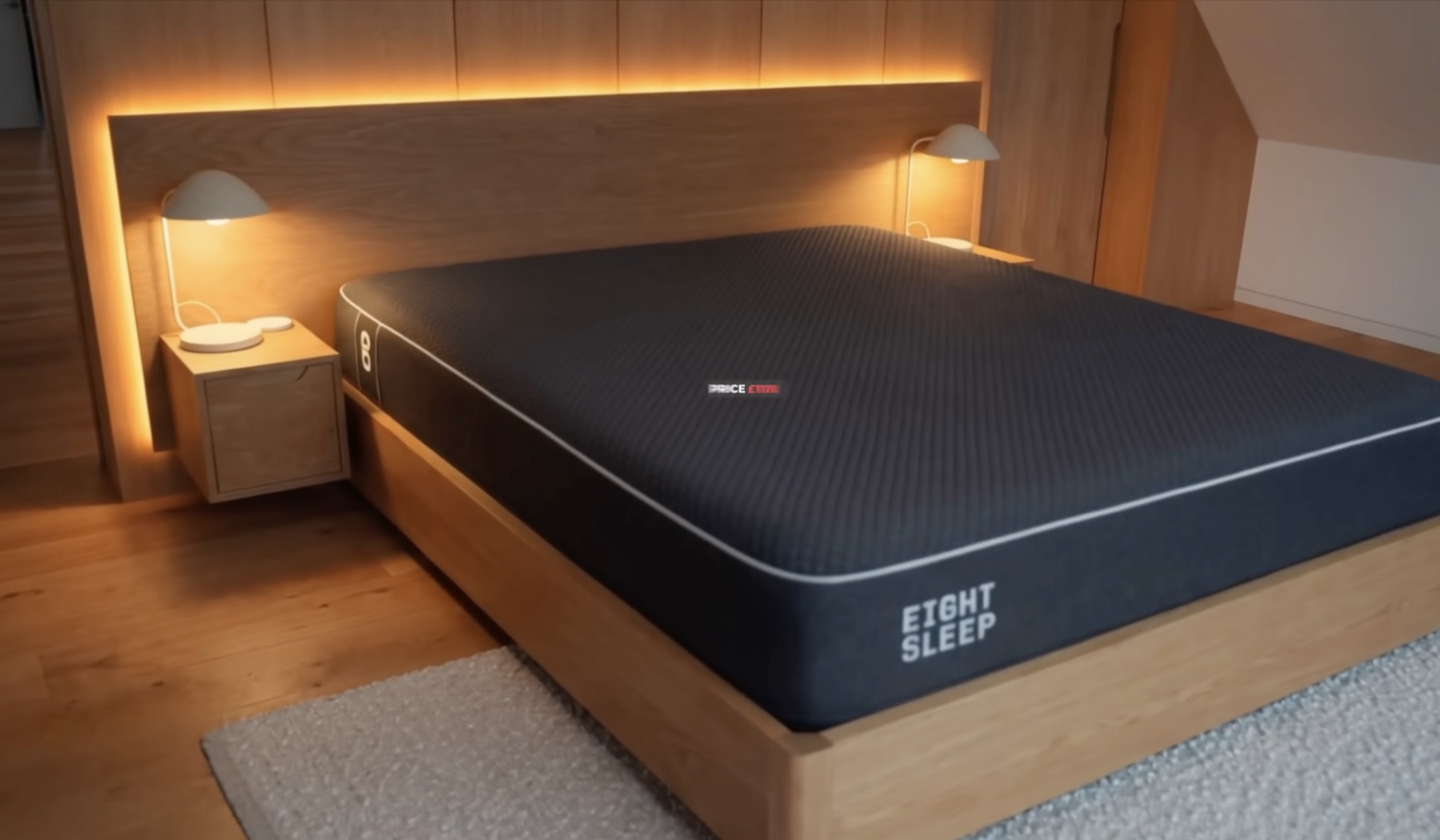 Eight Sleep mattress in an oak-panelled bedroom — built-in nightstands, warm cove lighting behind the headboard, matching pendant reading lights on both sides